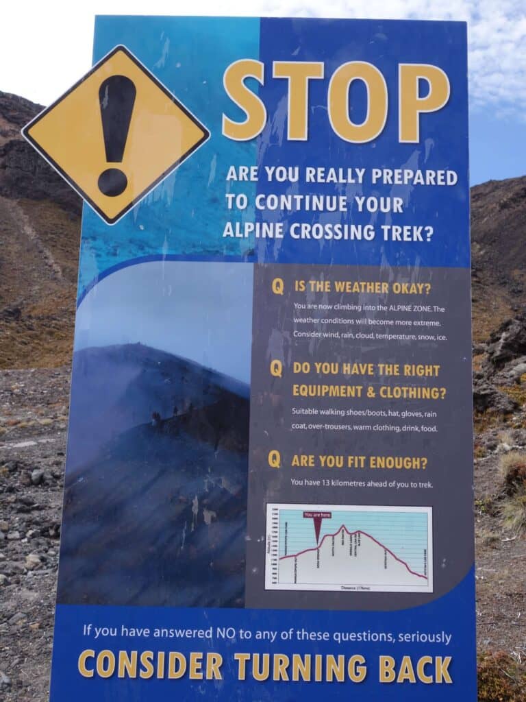 Warning sign before starting the alpine crossing