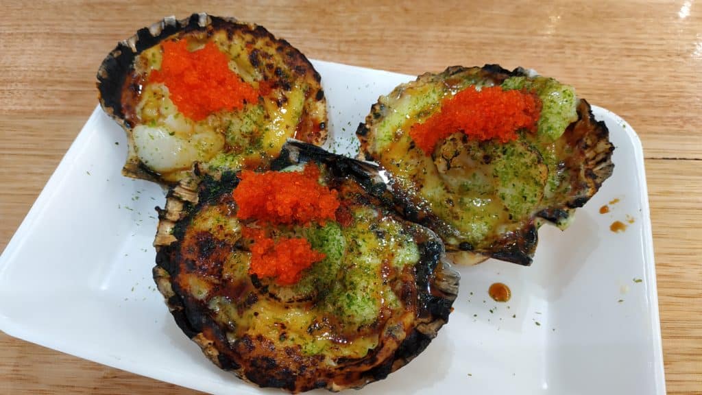 Flame grilled scallops in the shell