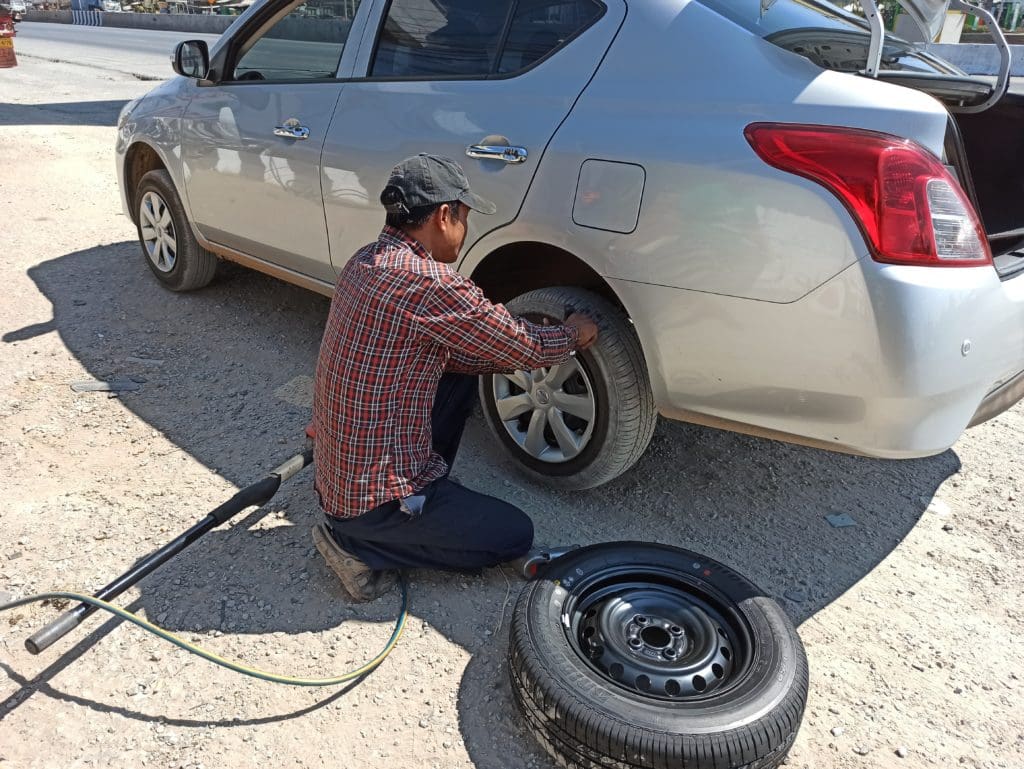 Man replacing tyre