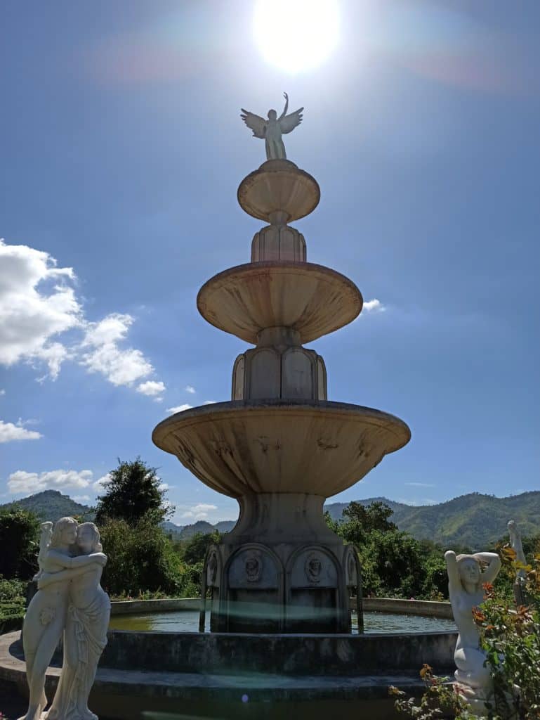 Fountain with sun behind