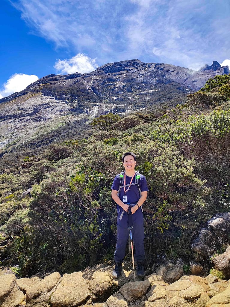 Guy with Mount Kinabalu at the back