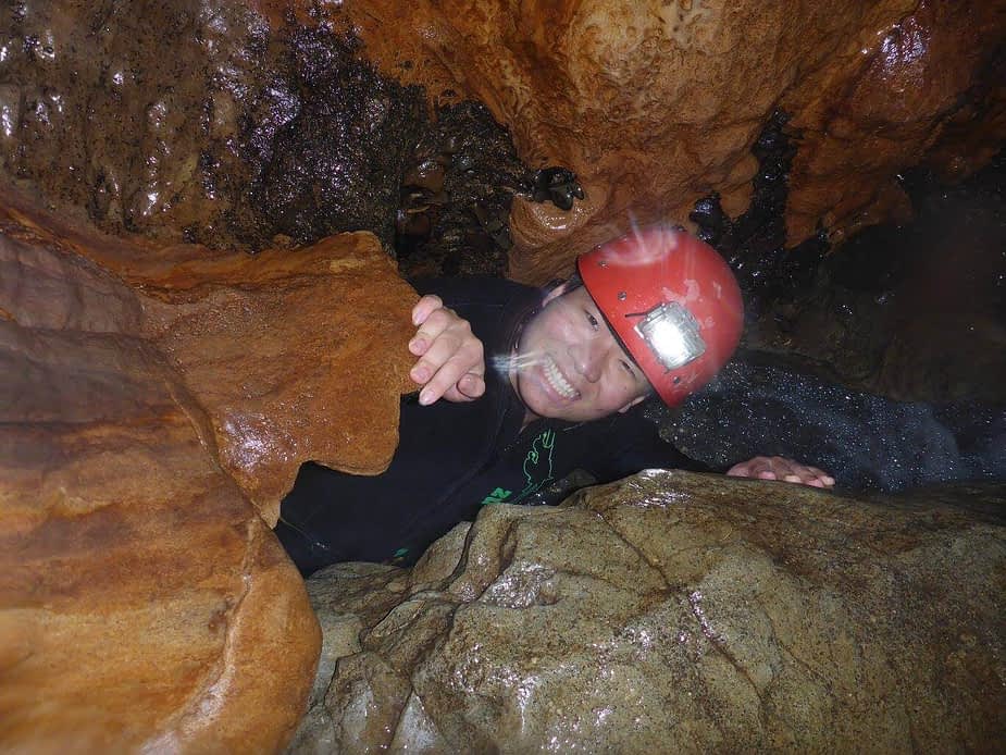 Crawling in the cave in New Zealand